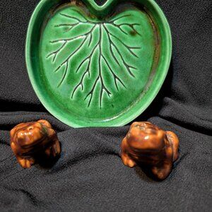 Ceramic frog salt and pepper shakers on lily pad plate